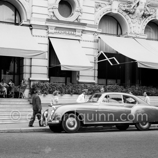 Aristotle Onassis and his wife Tina in front of the Hotel de Paris. Monte Carlo 1953. 1952 Bentley R-Type Continental, #BC25A, 2-Door Fastback Saloon by H.J.Mulliner. Detailed info on this car by expert Klaus-Josef Rossfeldt see About/Additional Infos. - Photo by Edward Quinn