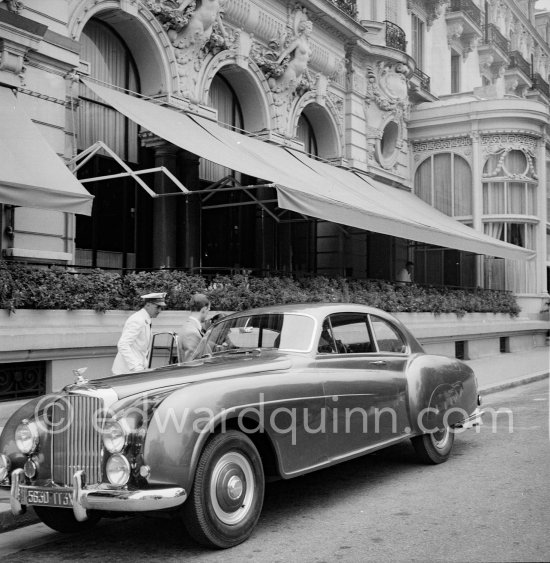 Aristotle Onassis in front of the Hotel de Paris. Monte Carlo 1953. His car: 1952 Bentley R-Type Continental, #BC25A, 2-Door Fastback Saloon by H.J.Mulliner. Detailed info on this car by expert Klaus-Josef Rossfeldt see About/Additional Infos. - Photo by Edward Quinn