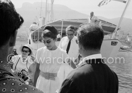 Maria Callas and Aristotle Onassis leaving Onassis\' yacht Christina. Monaco harbor 1959. - Photo by Edward Quinn