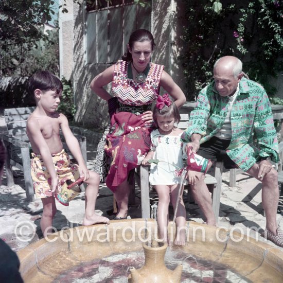 Picasso, Françoise Gilot and their children Claude and Paloma in the garden of La Galloise. Françoise Gilot with a pendant by Picasso. Vallauris 1953. - Photo by Edward Quinn