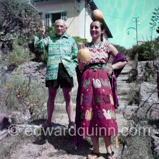 Picasso and Françoise Gilot in the garden of "La Galloise”. Françoise Gilot with a pendant by Picasso. Vallauris 1953. - Photo by Edward Quinn