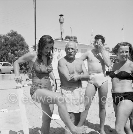 Françoise Gilot, Pablo Picasso and unknown persons at the beach. Golfe-Juan 1954. - Photo by Edward Quinn