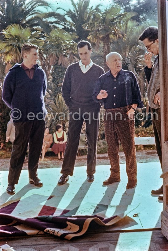 Pablo Picasso discussing with the expert Pierre Baudouin the project for a tapestry designed by him. Luis Miguel Dominguin and at left Paulo Picasso. La Californie, Cannes 1959. - Photo by Edward Quinn