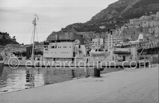 "Olympic Whaler", the whaling ship of Aristotle Onassis. With Italian twin-engine amphibian flying boat I-FIMA, prototype of Piaggio P-136. Monaco harbor 1952. - Photo by Edward Quinn