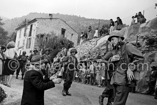 Frank Sinatra on the set of the film "Kings Go Forth" in the village of Tourette-sur-Loup, 1957. Sinatra needed an old lady to partner him in this scene. The villager Marie Isnard, who had never been to the cinema in her life, learned her lines and got through the dialogue very successfully. Sinatra\'s lines were: "Vive General de Gaulle, Vive les Folies-Bergère", about the only French he knew. - Photo by Edward Quinn