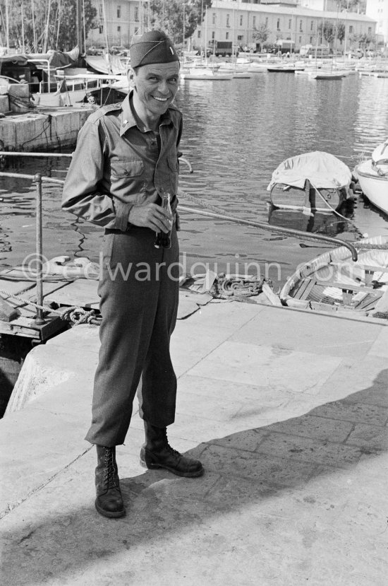 Lt. Sam Loggins (Frank Sinatra) drinking Coca-Cola during the filming of "Kings Go Forth". Villefranche-sur-Mer 1957. - Photo by Edward Quinn