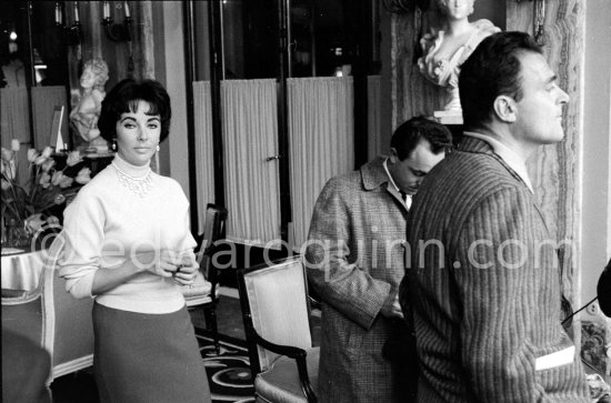 Attended by Cartier jewellers Liz Taylor tries on a beautiful diamond necklace with matching earrings she spotted while window-shopping in Monte Carlo with her third husband Mike Todd. At $500,000, the necklace was beyond Todd’s budget, but the earrings were her consolation prize. Monte Carlo 1958. - Photo by Edward Quinn
