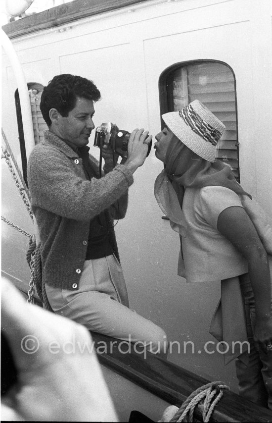 Blowing a kiss into new husband Eddie Fisher’s camera, on board the yacht Olnico, which they had chartered for their honeymoon cruise of the Mediterranean and berthed in the harbor at Cannes, 1959. - Photo by Edward Quinn