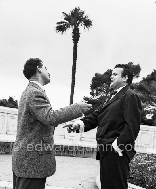 Orson Welles in front of the Casino in Monte Carlo interviewed by journalist Guy Riffet for Nice-Matin. Welles came to the Riviera to present his film "Othello" at the Cannes Film Festival. He received the "Palme d’Or" for the film. The film, at present a "classique", was vilified by most of the critics. Monte Carlo 1952. - Photo by Edward Quinn