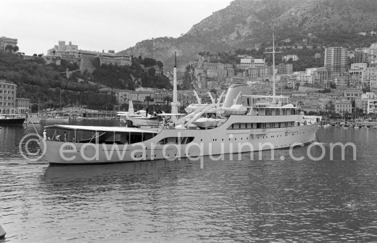 Onassis\' yacht Christina with Italian twin-engine amphibian flying boat G-APNY Piaggio P-136L SERIES 2 C/N 242. Monaco harbor with the palais in the background 1955. - Photo by Edward Quinn