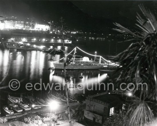 Yacht Christina of Aristotle Onassis lit up in harbor. Monaco 1954. - Photo by Edward Quinn