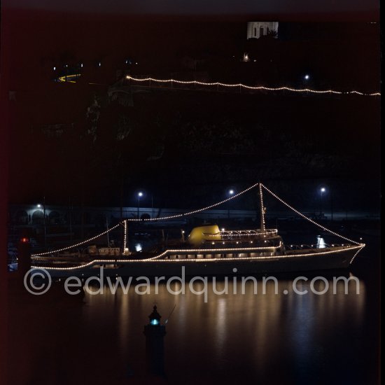 Yacht Christina of Aristotle Onassis lit up in harbor. Monaco 1954. - Photo by Edward Quinn