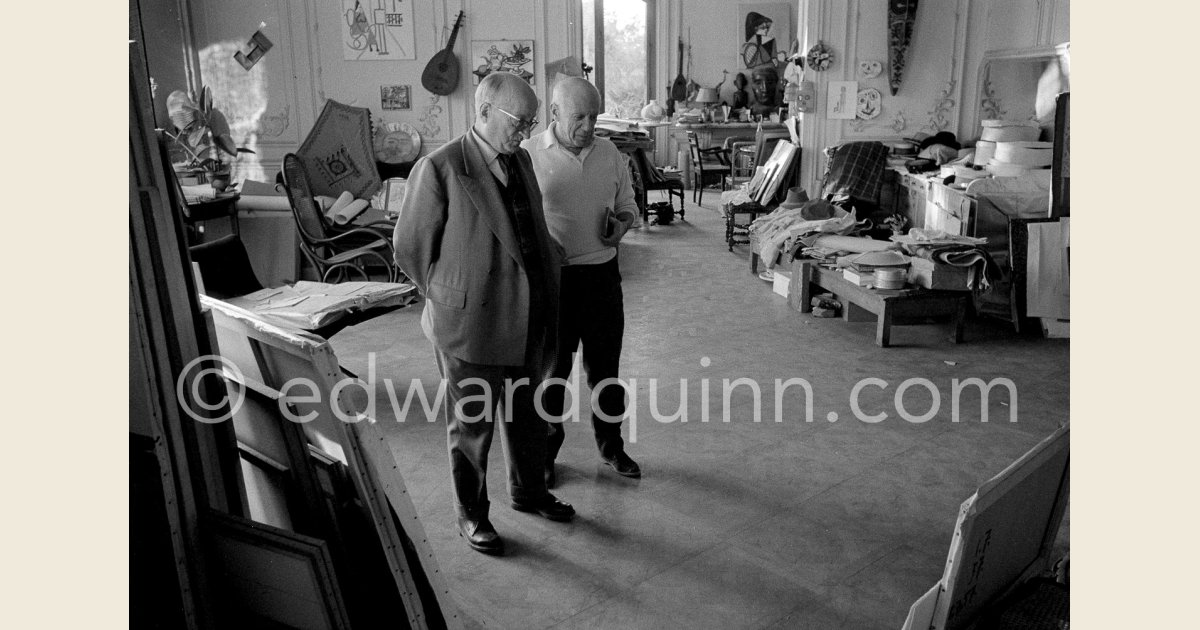 Jaime Sabartés and Pablo Picasso critically examine a portrait of