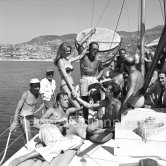 Brigitte Bardot during filming of "Manina, la fille sans voiles" on the yacht Suraya. With film director Willy Rozier, Jean-François Calvé and British actor Howard Vernon. Villefranche harbor 1952. - Photo by Edward Quinn