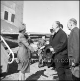 The onlookers saw Princess Elizabeth, later Queen Elizabeth II, very stylishly dressed disembarking from a Viking aircraft during the stop she made at Nice Airport, while on a flight from London to Malta where she was going to meet the Duke of Edinburgh, Prince Philip. She was greeted by local officials. Nice 19.3.1951. - Photo by Edward Quinn