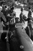 Manual fuel level measurement. Juan Manuel Fangio, (34) Alfa Romeo 158 Alfetta, winner of the Monaco Grand Prix 1950. On the right Giuseppe "Nino" Farina. - Photo by Edward Quinn