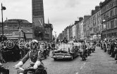 Visit of President Kennedy to Ireland. Cavendish Row, on the left Ambassodor cinema and Parnell Monument Dublin 1963. Car: Lincoln Cosmopolitan 1950 - Photo by Edward Quinn