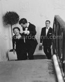 Edith Piaf and her young American painter friend arrive for the "Bal des Petits Lits Blancs" at Monte Carlo, a charity Gala Evening where Piaf was to sing. Monte Carlo 1959. - Photo by Edward Quinn