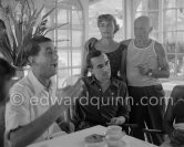 Déjeuner at restaurant Nounou. Francisco Reina "El Minuni" singing. Pablo Picasso and his daughter Maya Picasso listening. Unknown person. Golfe-Juan 1954. - Photo by Edward Quinn
