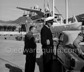 The captain of "Olympic Whaler", the whaling ship of Aristotle Onassis. With Italian twin-engine amphibian flying boat I-FIMA, prototype of Piaggio P-136. Nice harbor 1952. - Photo by Edward Quinn