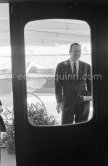 John Wayne on board Onassis' yacht Christina. Monaco harbor 1955. - Photo by Edward Quinn