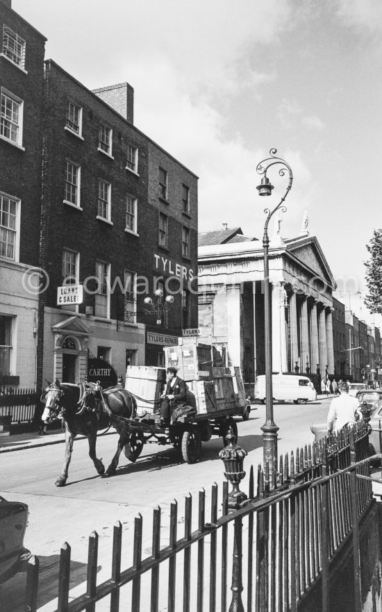 A pawn shop (The Three Balls) with the typical sign beside the St Marys Pro-Cathedral Marlborough Street. Tylers was a shoe shop chain. Dublin 1963. - Photo by Edward Quinn