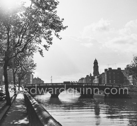 The River Liffey near Arran Quay. Father Mathew Bridge, St Paul\'s Church on the other side. Dublin 1963. - Photo by Edward Quinn