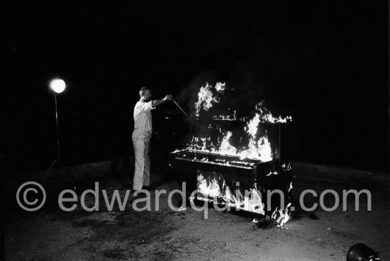 Arman, French artist. Burning Piano performance. Nice 1967 - Photo by Edward Quinn