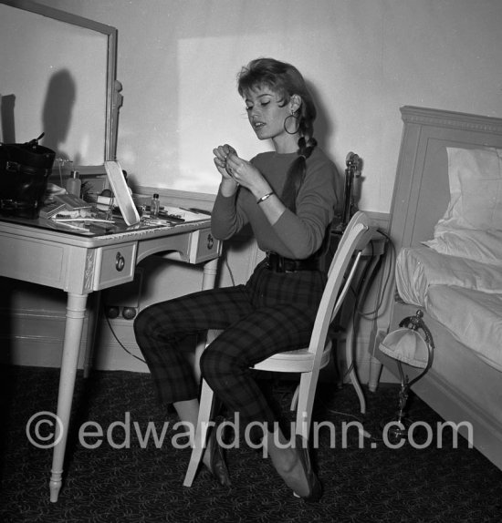 Brigitte Bardot  in her room at the Hotel Negresco. With a portable radio. Nice 1955. - Photo by Edward Quinn