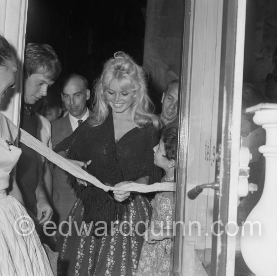 Brigitte Bardot opening an exhibition at Saint-Tropez 1958. - Photo by Edward Quinn