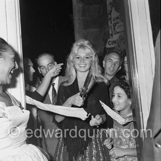 Brigitte Bardot opening an exhibition at Saint-Tropez 1958. - Photo by Edward Quinn