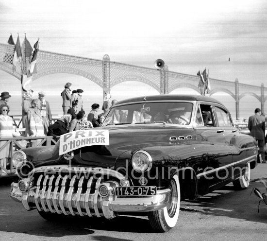 Concours d’Elégance Automobile at Cannes. Categorie F: No. 64 1950 Buick Super Riviera Sedan Model 52 of Princess Colleredo-Mansfeld won Prix d\'Honneur. She also won "Prix de la plus élégante toilette habillé (the most elegant ensemble). Cannes, 28.3.1951. - Photo by Edward Quinn