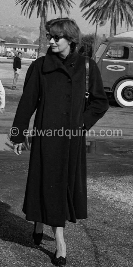 Greta Garbo with American businessman and boyfriend George Schlee (l) arriving at Nice Airport 1956. - Photo by Edward Quinn