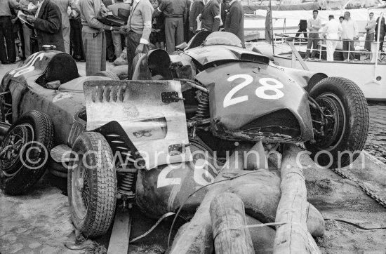 After the race: The cars of Mike Hawthorn, (28) Ferrari-Lancia D50 and Peter Collins, (26) Ferrari 801 in the barriers while Wolfgang von Trips, (24) Ferrari 80I, passes. The incident happend in lap 4 of the 1957 Monaco Grand Prix after leader Stirling Moss "lost" his Vanwall in the chicane. Peter Collins swerved to avoid Moss but hit the wall while Mike Hawthorn rammed Tony Brooks who braked hard to avoid the cars in front of him. - Photo by Edward Quinn