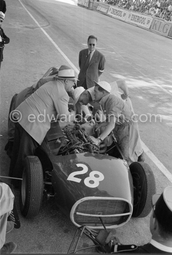 Stirling Moss, (28) Vanwall VW7, stops at the pits with valve problems. Tony Vandervell (white hat), founder of the Vanwall Formula One racing team. Monaco Grand Prix 1958. - Photo by Edward Quinn