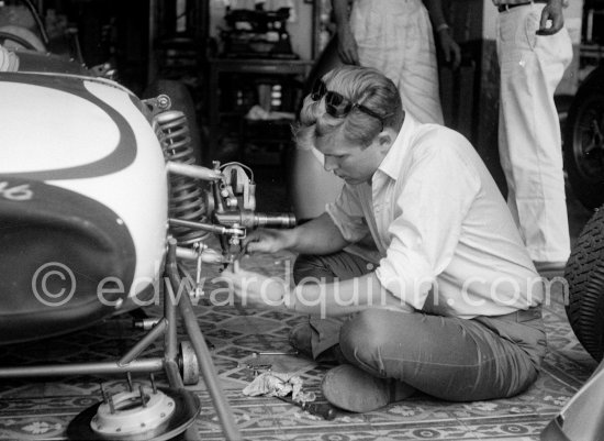 In a backstreet garage of Monte Carlo, Lance Reventlow, the driver-owner-constructor, helps to prepare his Scarab car for the race. Monaco Grand Prix 1960. - Photo by Edward Quinn