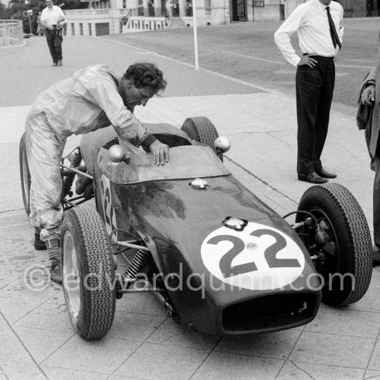 Innes Ireland pushes his N° 22 Lotus 18 uphill and right around the twisting Monaco circuit so that he can finish the race. His effort was repaid when he got 9th place and one point for the world championship. Monaco Grand Prix 1960. - Photo by Edward Quinn