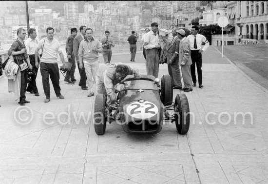 Innes Ireland pushes his N° 22 Lotus 18 uphill and right around the twisting Monaco circuit so that he can finish the race. His effort was repaid when he got 9th place and one point for the world championship. Monaco Grand Prix 1960. - Photo by Edward Quinn