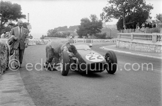 Innes Ireland pushes his N° 22 Lotus 18 uphill and right around the twisting Monaco circuit so that he can finish the race. His effort was repaid when he got 9th place and one point for the world championship. Monaco Grand Prix 1960. - Photo by Edward Quinn