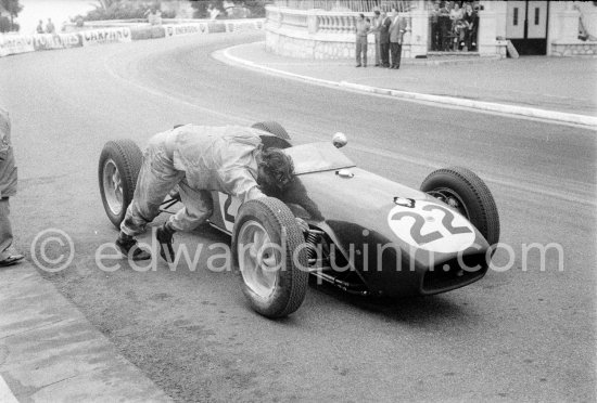 Innes Ireland pushes his N° 22 Lotus 18 uphill and right around the twisting Monaco circuit so that he can finish the race. His effort was repaid when he got 9th place and one point for the world championship. Monaco Grand Prix 1960. - Photo by Edward Quinn