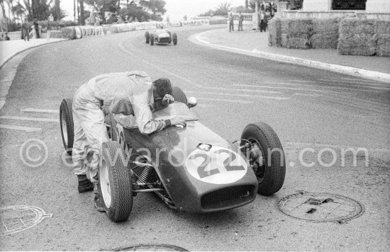 Innes Ireland pushes his N° 22 Lotus 18 uphill and right around the twisting Monaco circuit so that he can finish the race. His effort was repaid when he got 9th place and one point for the world championship. Monaco Grand Prix 1960. - Photo by Edward Quinn