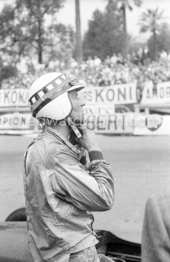 Innes Ireland pushes his N° 22 Lotus 18 uphill and right around the twisting Monaco circuit so that he can finish the race. His effort was repaid when he got 9th place and one point for the world championship. Monaco Grand Prix 1960. - Photo by Edward Quinn