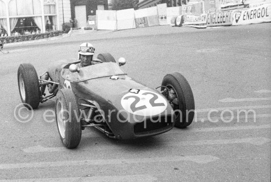 Innes Ireland pushes his N° 22 Lotus 18 uphill and right around the twisting Monaco circuit so that he can finish the race. His effort was repaid when he got 9th place and one point for the world championship. Monaco Grand Prix 1960. - Photo by Edward Quinn