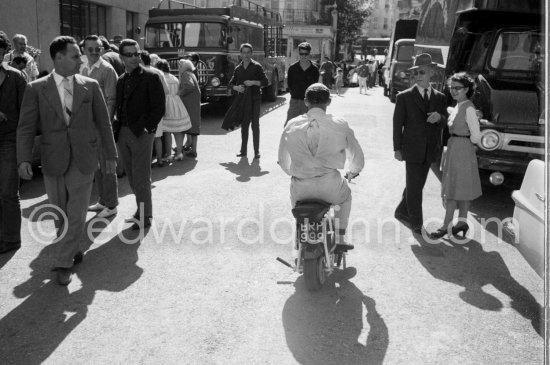 Stirling Moss enjoys riding around with his 1961 Trojan Trobike. Monaco Grand Prix 1961. - Photo by Edward Quinn