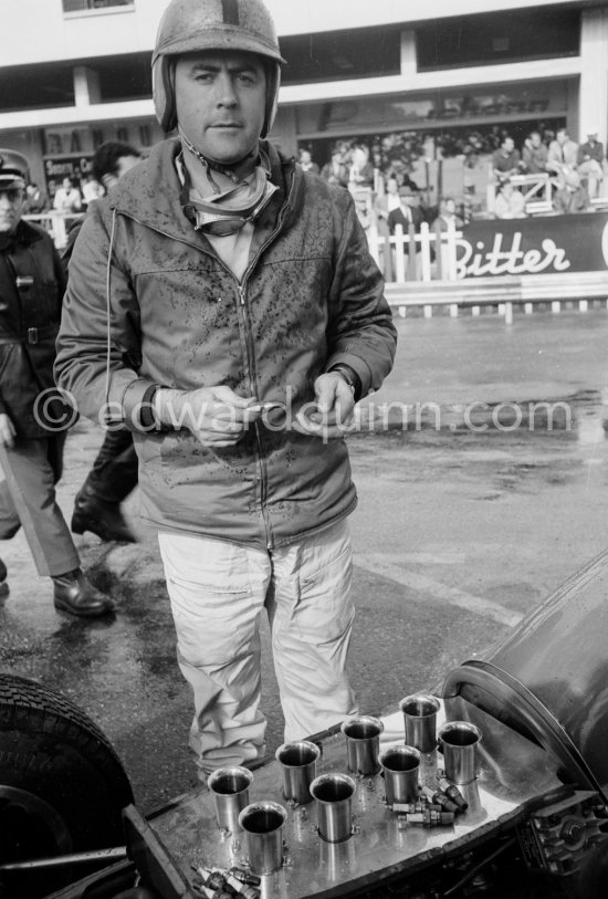 Jack Brabham, (22) Lotus 24, in trouble with a water-logged engine. Monaco Grand Prix 1962. - Photo by Edward Quinn