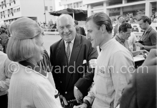 Graham Hill, Louis Stanley "Big Lou", B.R.M. chairman, and his wife. Monaco Grand Prix 1965. - Photo by Edward Quinn