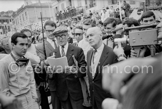 Driver briefing by Louis Chiron. Lorenzo Bandini (left). Monaco Grand Prix 1965. - Photo by Edward Quinn