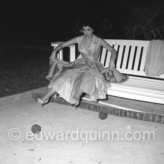 During the Cannes Film Festival in 1954,  Silvana Mangano invited her friend Gina Lollobrigida to her house La Casa del Mare. Silvana incited Gina to play the popular game of Pétanque. However Gina soon found out that her Sunday frock might not be ideal for that game. Roquebrune-Cap-Martin 1954. - Photo by Edward Quinn