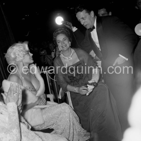 Jayne Mansfied, the Begum and the Cannes Festival organiser Robert Favre Le Bret. Cannes 1958. Composed of spectacular cushion, brilliant, and banquette shaped diamonds, this modern Diamond Fringe Necklace was likely created by Harry Winston and acquired by the Aga Khan at some point in the early 1950s.   . - Photo by Edward Quinn