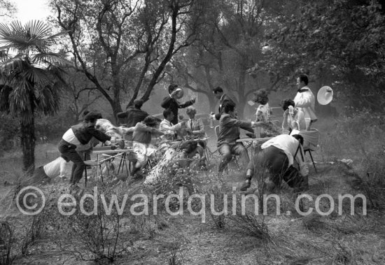 Paul Meurisse (white suit) during filming of “Le Déjeuner sur l\'herbe” at the Auguste Renoir house "Les Collettes". With the aid of mechanical wind devices a tempest, the mistral, turns the déjeuner into catastrophe. Cagnes-sur-Mer 1959. - Photo by Edward Quinn